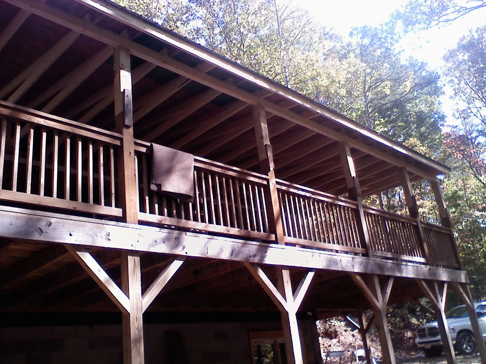 Timber framing under a new elevated porch and deck — Roof Leak Repair in Mapleton Depot by Roofing Brothers